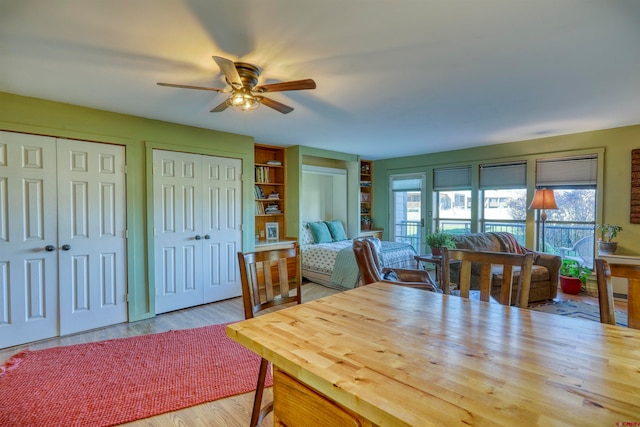 dining room with ceiling fan and light wood-type flooring