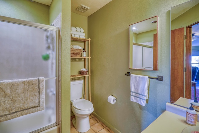 bathroom with toilet and tile patterned floors