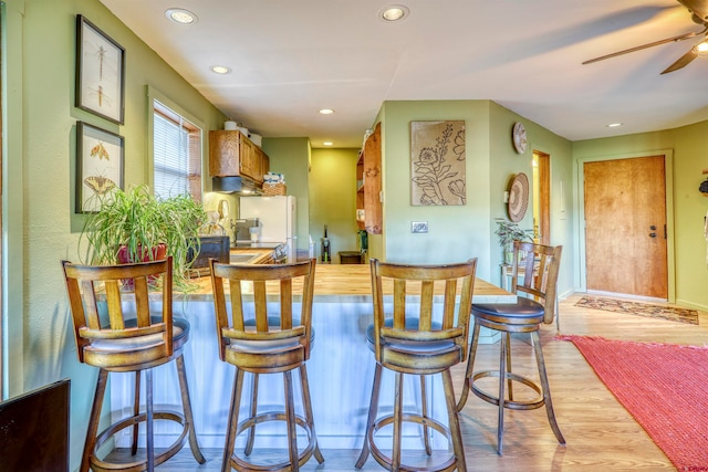 kitchen with light hardwood / wood-style floors and ceiling fan