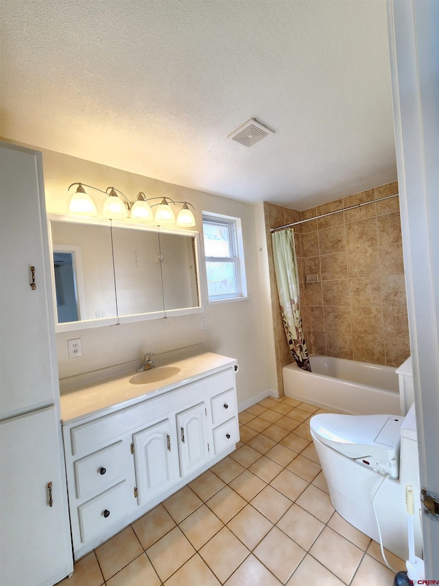 full bathroom featuring vanity, a textured ceiling, shower / bath combo, tile patterned flooring, and toilet