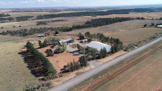 birds eye view of property featuring a rural view