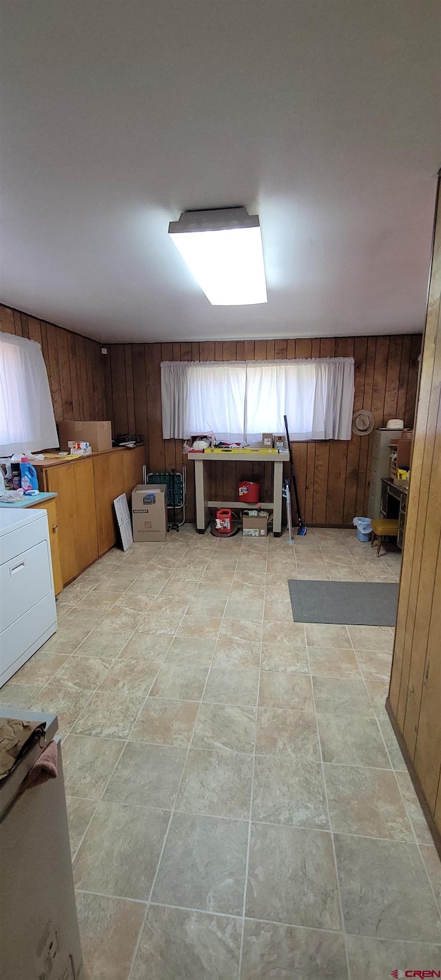 9966 Rd 7, Dove Creek, CO 81324 - kitchen featuring wood walls and washer / dryer