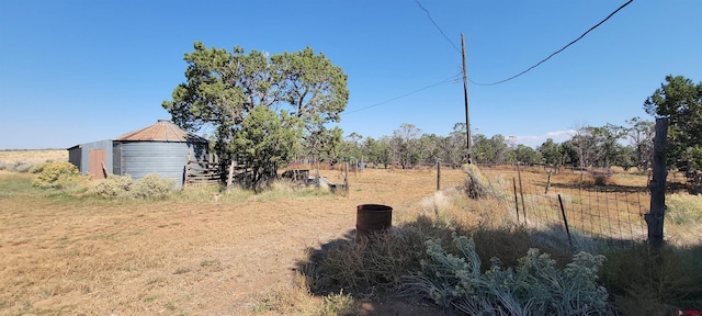 9966 Rd 7, Dove Creek, CO 81324 - view of yard featuring a detached garage and fence