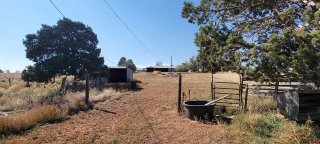 9966 Rd 7, Dove Creek, CO 81324 - view of yard featuring fence and a view of rural / pastoral area