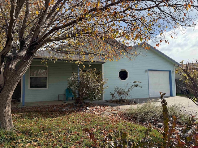 view of side of property with a garage