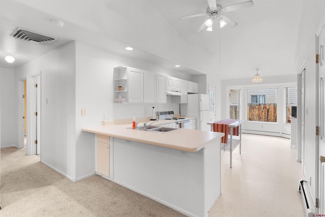 kitchen featuring white fridge, electric stove, white cabinets, a baseboard radiator, and kitchen peninsula