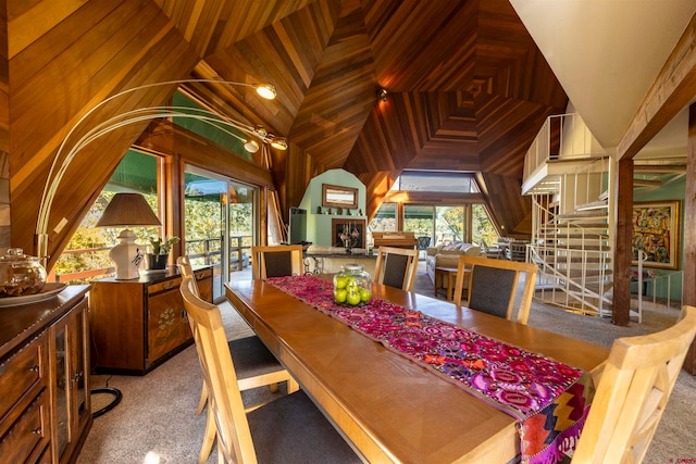 dining area featuring lofted ceiling