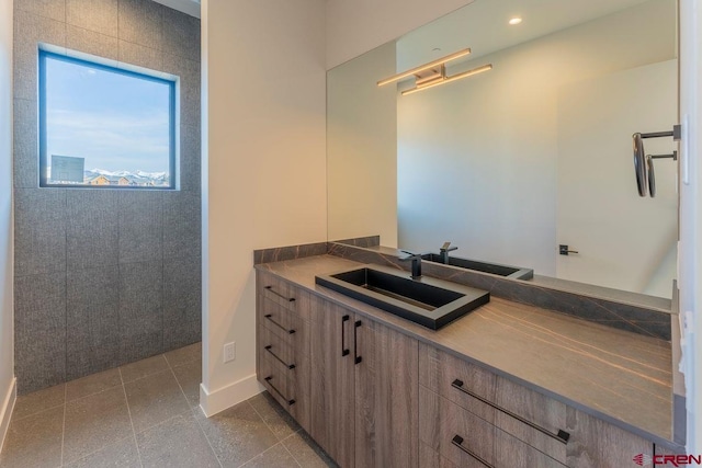 77 Coyote Ridge Rd, Crested Butte, CO 81224 - bathroom featuring vanity, baseboards, and recessed lighting