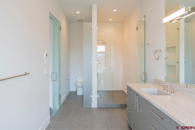 77 Coyote Ridge Rd, Crested Butte, CO 81224 - full bathroom with tile patterned flooring, a stall shower, vanity, baseboards, and toilet