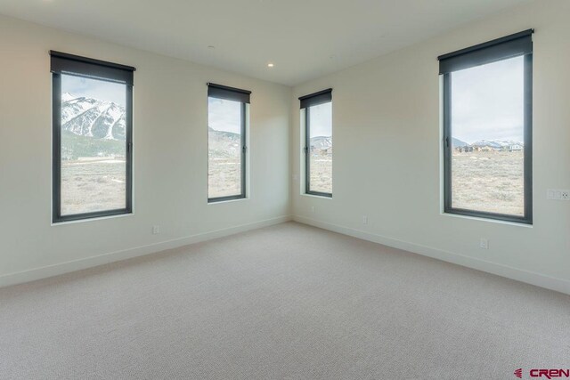 77 Coyote Ridge Rd, Crested Butte, CO 81224 - empty room with baseboards, recessed lighting, and light carpet