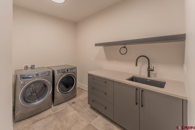 77 Coyote Ridge Rd, Crested Butte, CO 81224 - laundry room featuring baseboards, washer and clothes dryer, and a sink