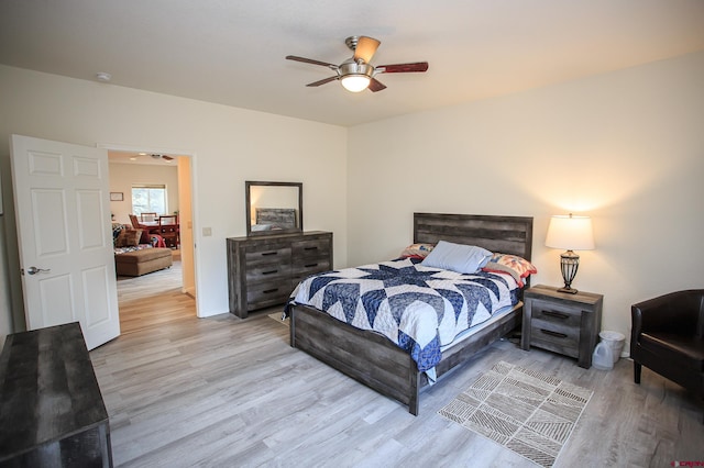 bedroom featuring light wood-type flooring and ceiling fan