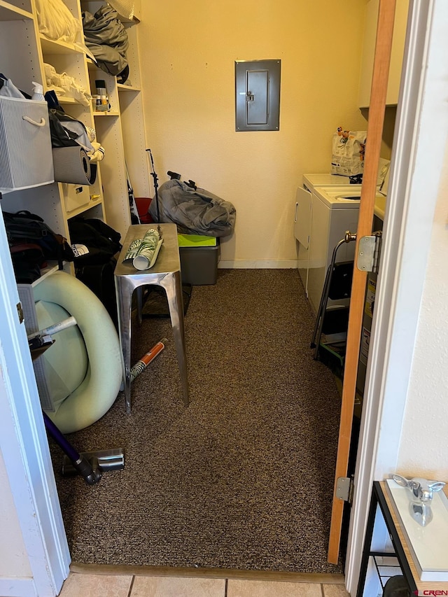 laundry area with washing machine and dryer and electric panel