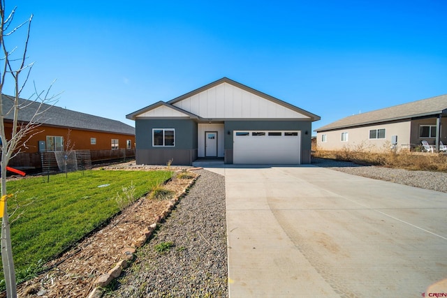 ranch-style home with a front lawn and a garage