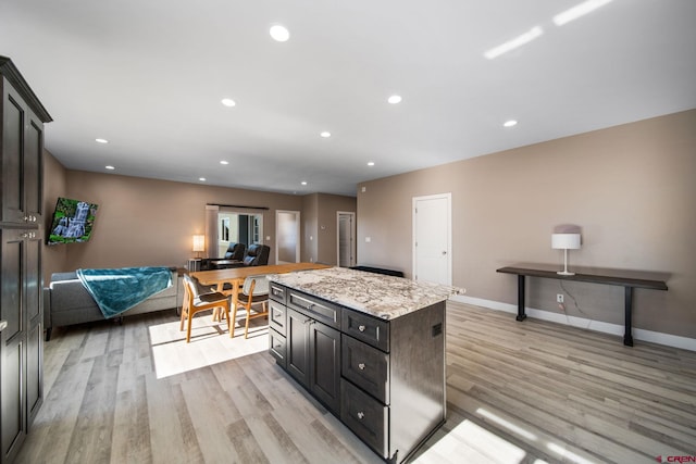 449 Birch St, Bayfield, CO 81122 - kitchen with light wood-type flooring, baseboards, a kitchen island, and recessed lighting
