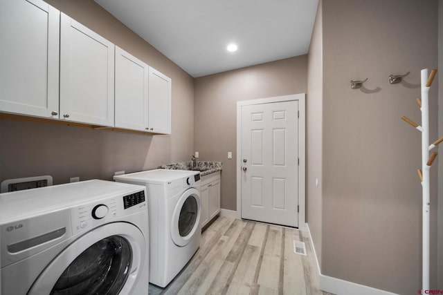 449 Birch St, Bayfield, CO 81122 - laundry area featuring cabinet space, washing machine and clothes dryer, light wood-style floors, baseboards, and recessed lighting