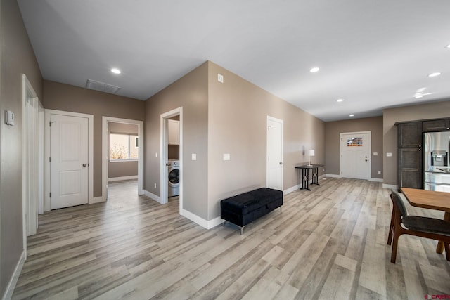 449 Birch St, Bayfield, CO 81122 - hallway featuring washer / dryer, baseboards, light wood-style floors, and recessed lighting