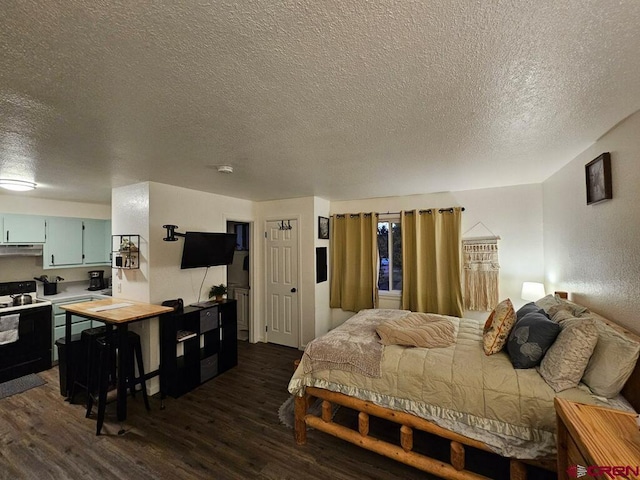 bedroom with dark hardwood / wood-style flooring and a textured ceiling