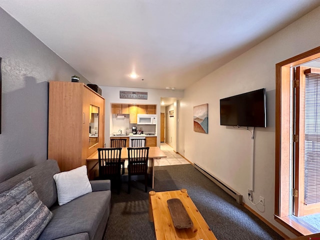 living room with baseboard heating, light carpet, and sink