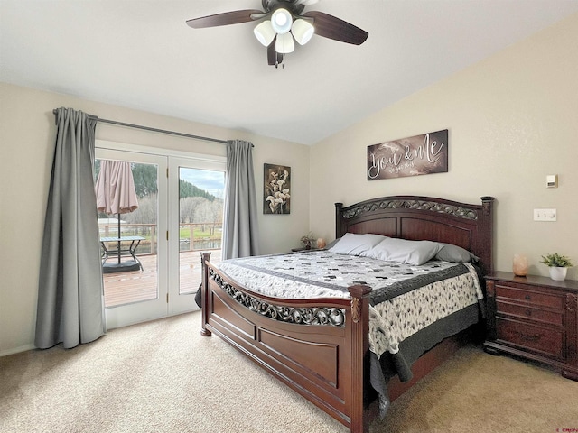 carpeted bedroom with access to exterior, ceiling fan, and lofted ceiling