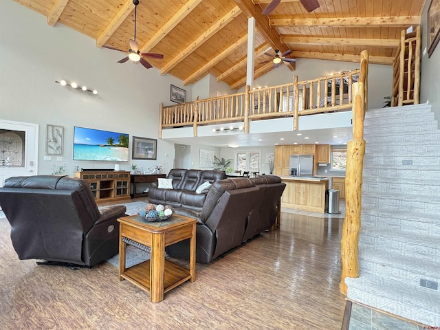 living room featuring high vaulted ceiling, wooden ceiling, and hardwood / wood-style flooring