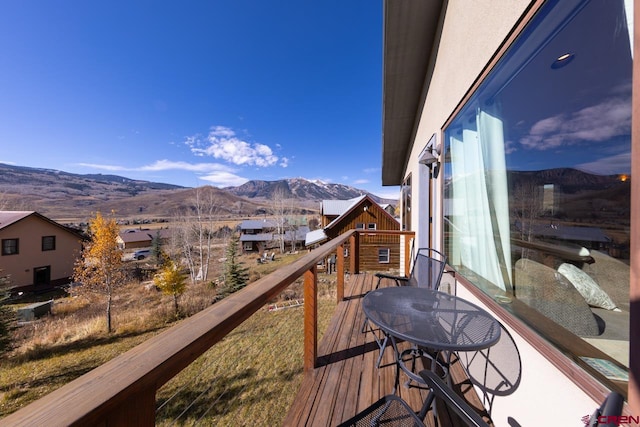 balcony featuring a mountain view