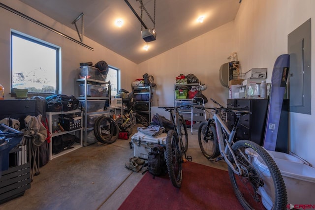 garage featuring electric panel and a garage door opener