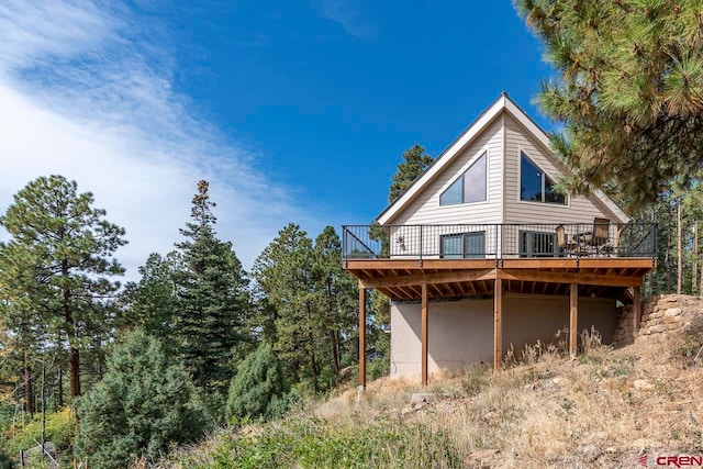 view of home's exterior with a deck