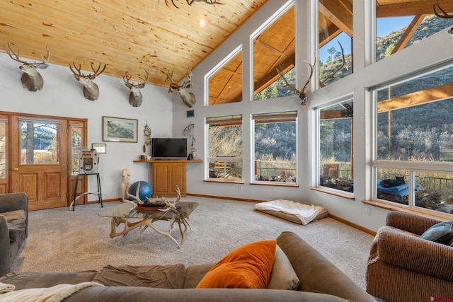 carpeted living room featuring beamed ceiling, wooden ceiling, and high vaulted ceiling