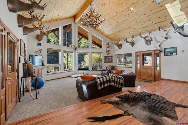 living room with hardwood / wood-style floors, high vaulted ceiling, wooden ceiling, and beam ceiling