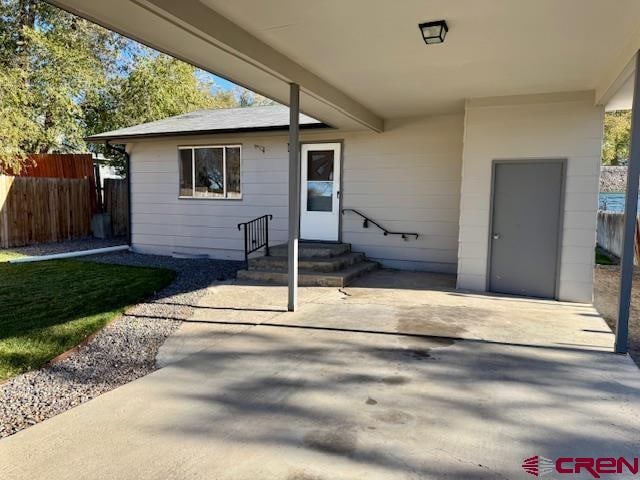 entrance to property featuring a patio