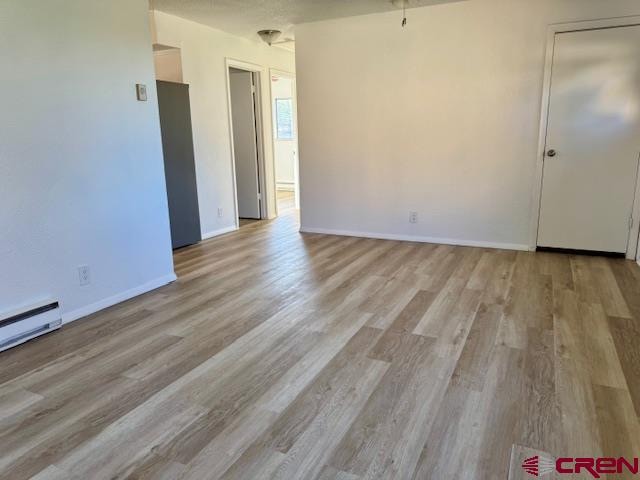 spare room with light wood-type flooring