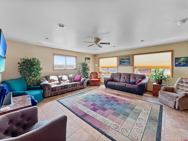 living room with ceiling fan and light tile patterned flooring