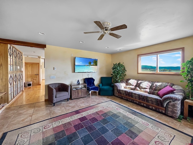 living room featuring light wood-type flooring and ceiling fan