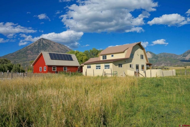 exterior space featuring a mountain view and an outbuilding