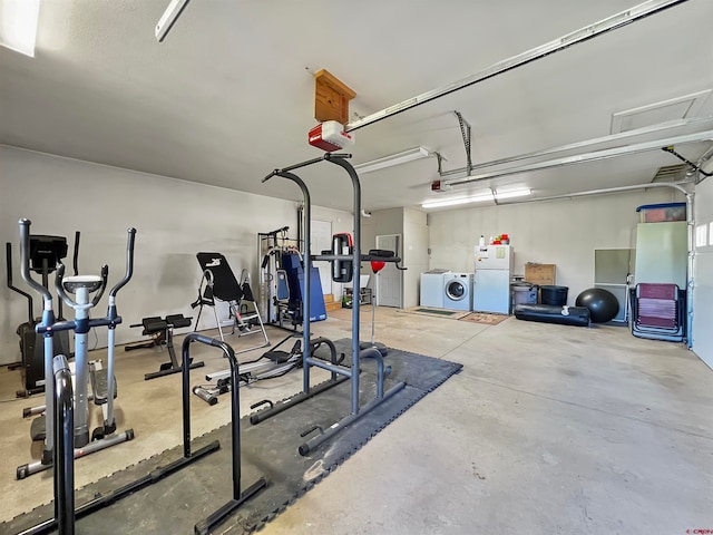 workout room with concrete flooring and separate washer and dryer