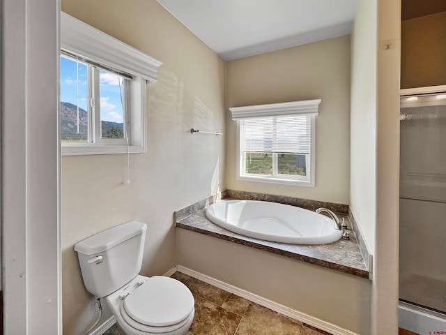 bathroom with shower with separate bathtub and toilet