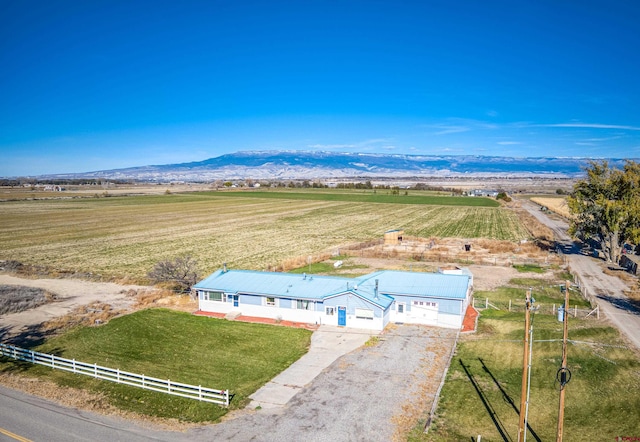 birds eye view of property featuring a mountain view and a rural view