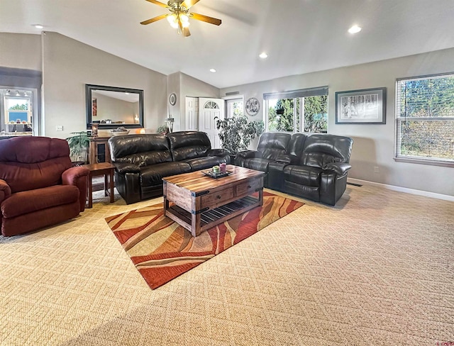 living room with light colored carpet, ceiling fan, and lofted ceiling