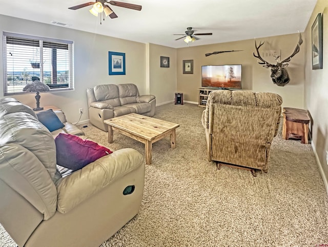 living room featuring ceiling fan and light colored carpet