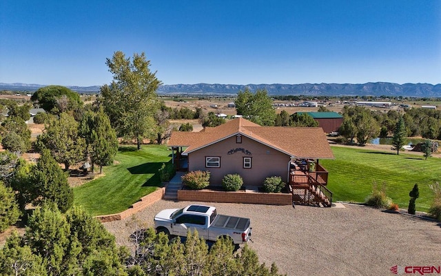 birds eye view of property with a mountain view