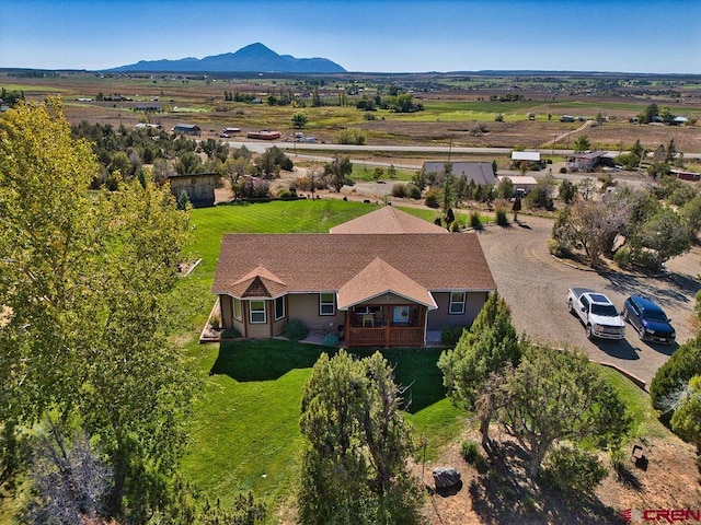 birds eye view of property featuring a mountain view