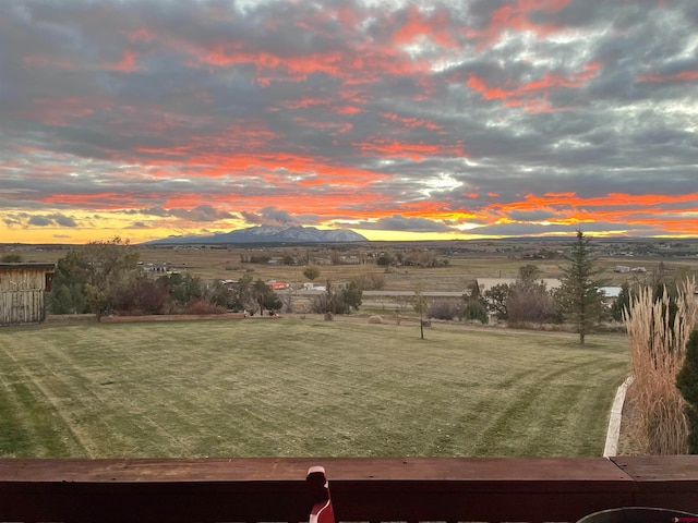 yard at dusk with a mountain view