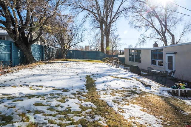 view of yard covered in snow