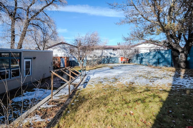 view of yard covered in snow