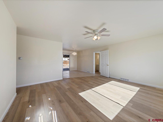 spare room featuring hardwood / wood-style flooring and ceiling fan