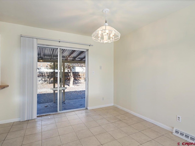 unfurnished dining area featuring light tile patterned floors and a chandelier