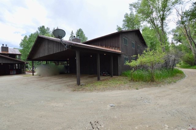 view of side of property with a carport