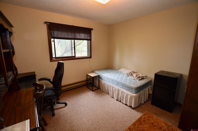 carpeted bedroom featuring a textured ceiling and a baseboard radiator