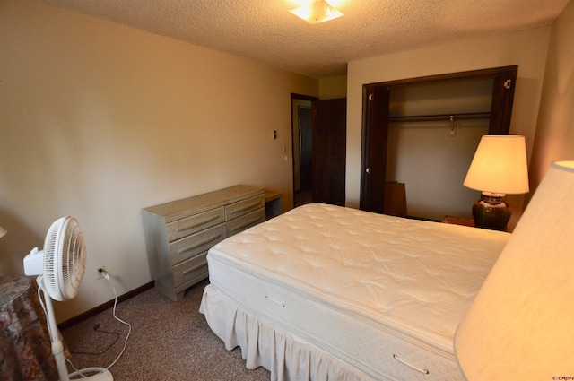 carpeted bedroom featuring a closet and a textured ceiling